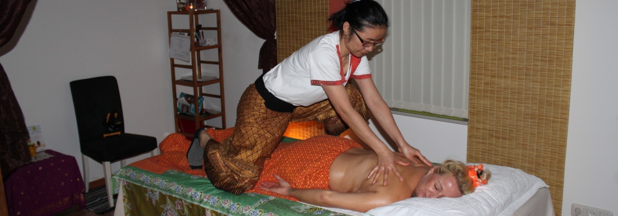 woman practising thai massage