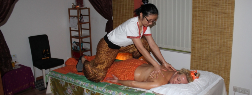 woman practising thai massage