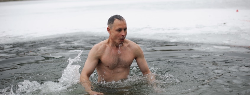 man doing ice baths